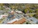 Aerial view of the neighborhood, highlighting its proximity to shops, parking, and local roadways at 8425 E Franklin St, Mount Pleasant, NC 28124