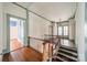 Hallway with wood floors, stairs, and classic trim at 8425 E Franklin St, Mount Pleasant, NC 28124