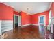 Spacious living room with fireplace, hardwood floors, and built-in shelving at 8425 E Franklin St, Mount Pleasant, NC 28124