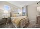 Cozy bedroom with a neutral palette, soft lighting and plush bedding at 8642 Miles Gap Rd, Indian Land, SC 29707