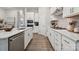 Modern kitchen with stainless steel appliances, gas cooktop, and white cabinetry at 8642 Miles Gap Rd, Indian Land, SC 29707