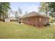 Spacious backyard with lawn and wooded perimeter at 8801 Oldenburg Dr, Mount Pleasant, NC 28124