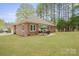 Spacious backyard showcasing well-maintained lawn and a patio area for outdoor enjoyment at 8801 Oldenburg Dr, Mount Pleasant, NC 28124