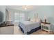 Comfortable bedroom featuring matching nightstands and bright natural light at 8801 Oldenburg Dr, Mount Pleasant, NC 28124