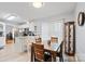 Bright dining area features a wooden table and granite countertop bar with seating at 8801 Oldenburg Dr, Mount Pleasant, NC 28124