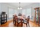 Elegant dining room featuring a wooden table with seating for six and lots of natural light at 8801 Oldenburg Dr, Mount Pleasant, NC 28124