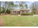 Charming brick home featuring manicured landscaping and a well-maintained front yard at 8801 Oldenburg Dr, Mount Pleasant, NC 28124