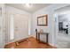 Bright foyer featuring hardwood floors, a decorative table, and a welcoming atmosphere at 8801 Oldenburg Dr, Mount Pleasant, NC 28124