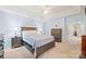 Spacious main bedroom features a tray ceiling, two windows and neutral decor at 8801 Oldenburg Dr, Mount Pleasant, NC 28124