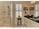 Bathroom featuring a glass enclosed shower, granite countertop, and a window with shutters at 9703 Cotton Stand Rd, Charlotte, NC 28277