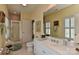 Bright bathroom with large mirror, tiled floor, and glass-enclosed shower at 9703 Cotton Stand Rd, Charlotte, NC 28277