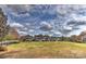Community green with views of neighborhood homes under a cloudy sky at 9703 Cotton Stand Rd, Charlotte, NC 28277