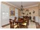 Elegant dining room featuring wallpaper, a chandelier, a large dining table, and ample seating for entertaining guests at 9703 Cotton Stand Rd, Charlotte, NC 28277