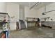 Spacious two-car garage with plenty of storage shelves at 9703 Cotton Stand Rd, Charlotte, NC 28277