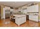 Gourmet kitchen showcasing a center island, stainless steel appliances, and custom cabinetry at 9703 Cotton Stand Rd, Charlotte, NC 28277