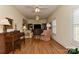 Spacious living room with hardwood floors, coffered ceilings, and ample seating at 9703 Cotton Stand Rd, Charlotte, NC 28277