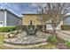 Charming flagstone patio with outdoor seating and manicured landscaping at 9703 Cotton Stand Rd, Charlotte, NC 28277