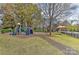 Community playground with play structures, slide, and climbing wall at 9703 Cotton Stand Rd, Charlotte, NC 28277