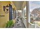 Relaxing front porch with rocking chairs, offering a serene spot to enjoy the neighborhood views and outdoor ambiance at 9703 Cotton Stand Rd, Charlotte, NC 28277