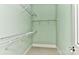 Functional walk-in closet with shelving and neutral paint at 9703 Cotton Stand Rd, Charlotte, NC 28277