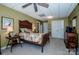 Bedroom with a large window, wooden furniture, and double door closet at 1027 Brookline Dr, Huntersville, NC 28078