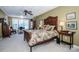 Bright bedroom with a large window, wooden furniture, and decorative accents at 1027 Brookline Dr, Huntersville, NC 28078