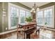 Sunlit breakfast nook featuring a dining table with bench seating and large windows offering natural views at 1027 Brookline Dr, Huntersville, NC 28078