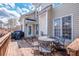 Inviting outdoor deck with table, chairs, and grill, offering a great space for relaxation and outdoor cooking at 1027 Brookline Dr, Huntersville, NC 28078