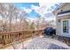 Outdoor deck featuring wood railings and a metal table with chairs, perfect for entertaining with a view at 1027 Brookline Dr, Huntersville, NC 28078