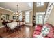 Open-concept foyer with high ceilings, hardwood floors, and dining room access at 1027 Brookline Dr, Huntersville, NC 28078