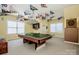 Spacious game room with a billiard table and unique sports pennant decor at 1027 Brookline Dr, Huntersville, NC 28078