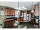 Beautiful kitchen featuring granite countertops, dark wood cabinets, and stainless steel refrigerator at 1027 Brookline Dr, Huntersville, NC 28078