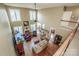 Spacious living room with hardwood floors, a fireplace, and plenty of natural light from large windows at 1027 Brookline Dr, Huntersville, NC 28078