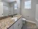 Bathroom featuring a granite vanity, a shower with sliding doors, and tile flooring at 111 Canada Dr, Statesville, NC 28677