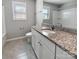 Bathroom featuring a granite vanity, a shower with sliding doors, and tile flooring at 111 Canada Dr, Statesville, NC 28677