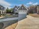 Two-story home with a manicured lawn and two-car garage at 1300 Lena St, Monroe, NC 28112