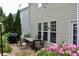 Outdoor dining area with table, chairs, and flower garden at 13127 Centennial Commons Pkwy, Huntersville, NC 28078