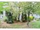 Secluded backyard with mature trees and lush landscaping, providing a tranquil outdoor experience at 13127 Centennial Commons Pkwy, Huntersville, NC 28078