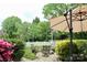 Relaxing backyard seating area beneath an umbrella, perfect for enjoying the outdoors at 13127 Centennial Commons Pkwy, Huntersville, NC 28078