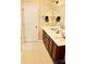 Dual vanity bathroom with tile flooring and ample storage space at 13127 Centennial Commons Pkwy, Huntersville, NC 28078