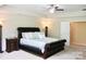 Spacious main bedroom featuring a king bed, nightstand, and ample lighting at 13127 Centennial Commons Pkwy, Huntersville, NC 28078