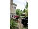 Inviting patio area with outdoor seating, grill, and lush landscaping for enjoyable outdoor gatherings at 13127 Centennial Commons Pkwy, Huntersville, NC 28078
