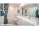 Bathroom featuring double sink vanity, large mirror, tub/shower, and decorative shower curtain at 133 Calvin Creek Dr, Troutman, NC 28166