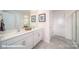 Bright bathroom featuring double sinks, white cabinetry and modern finishes for a spa-like feel at 133 Calvin Creek Dr, Troutman, NC 28166
