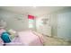 Comfortable bedroom with large window, dresser, soft bed, and carpet at 133 Calvin Creek Dr, Troutman, NC 28166