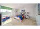 Vibrant bedroom features a comfortable bed, colorful decor, and a large window at 133 Calvin Creek Dr, Troutman, NC 28166
