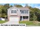 Charming two-story home with a blend of brick and siding, complemented by a manicured lawn at 133 Calvin Creek Dr, Troutman, NC 28166