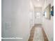 Bright hallway with hard wood floors, mirror on wall, and light switch visible in photo at 133 Calvin Creek Dr, Troutman, NC 28166