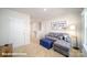 Relaxing living room with a gray sofa and blue ottoman that offers a comfortable and stylish place to unwind at 133 Calvin Creek Dr, Troutman, NC 28166