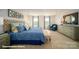 Elegant main bedroom with a large bed, stylish furniture, and bright windows, offering a comfortable retreat at 133 Calvin Creek Dr, Troutman, NC 28166